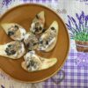 Sliced pear with yogurt and seeds on a plate